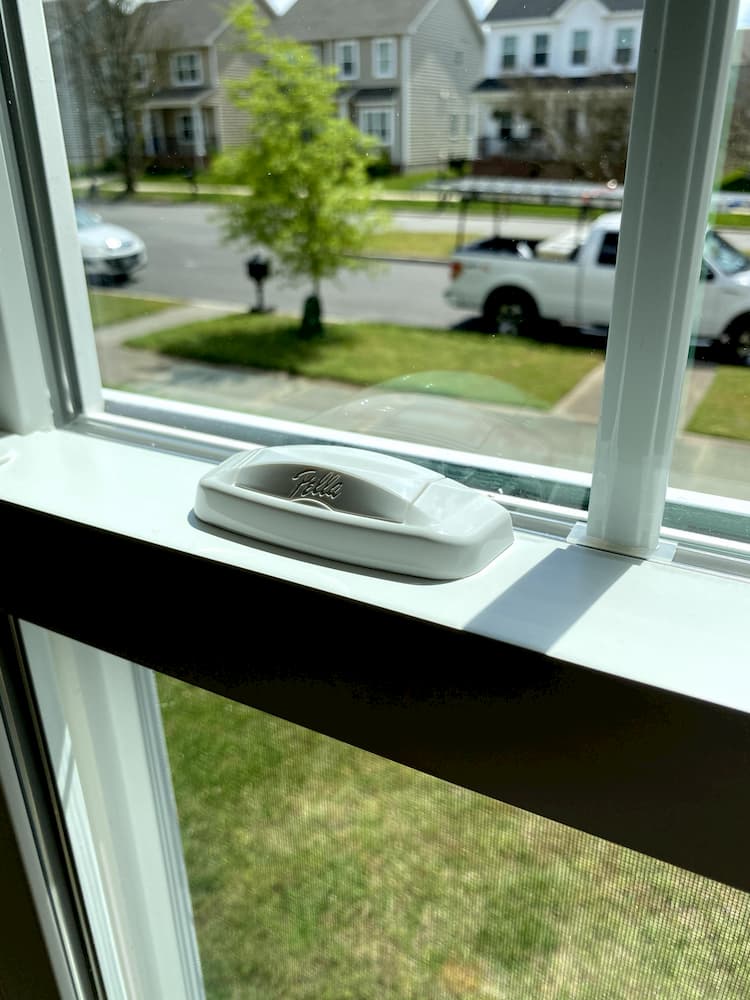 Close up of Pella window hardware on a white window