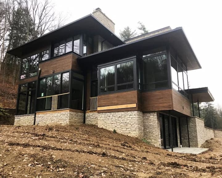 Exterior view of modern home near Cleveland Ohio featuring large black replacement windows