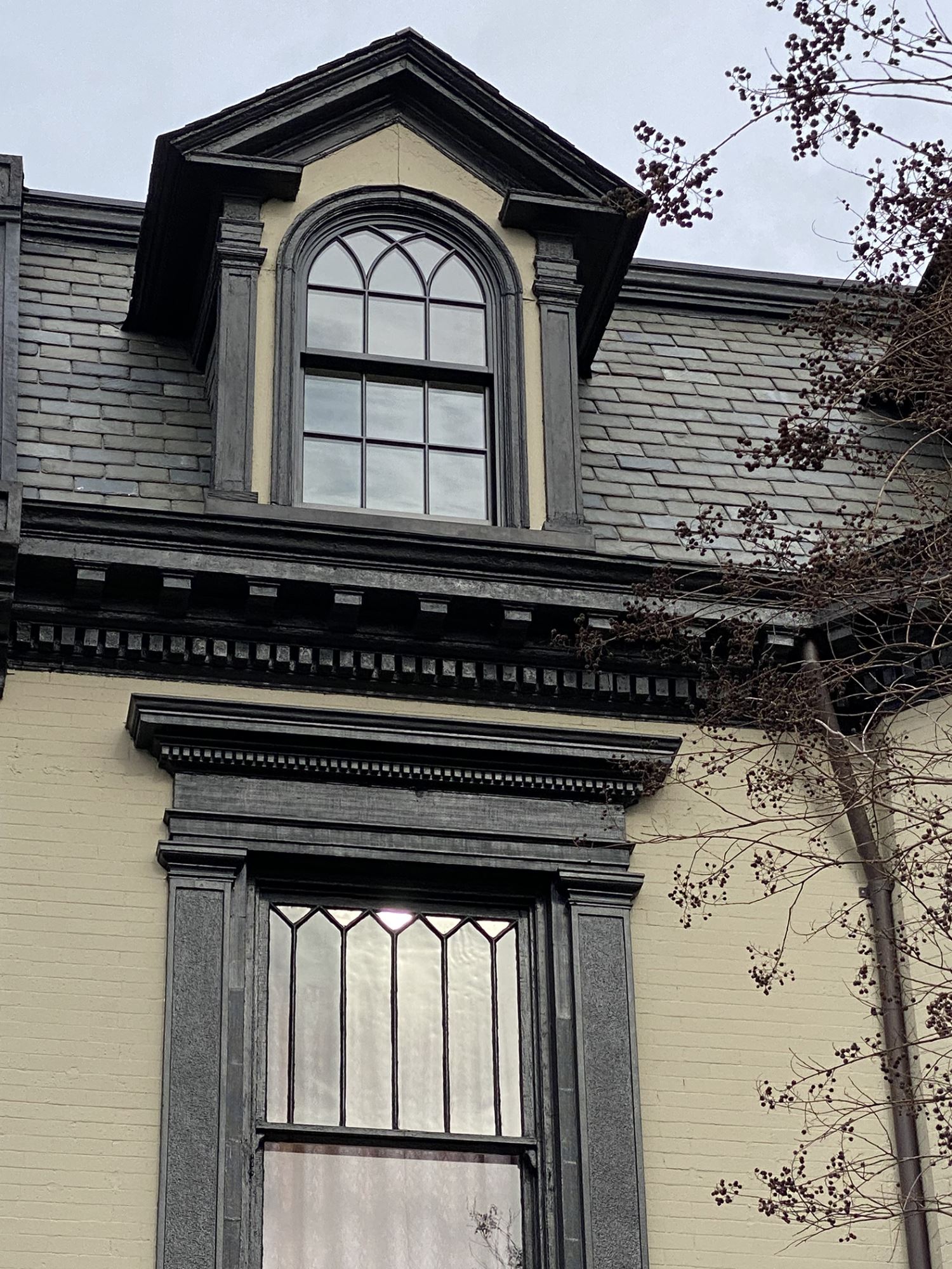 Exterior dormer window with arch and custom grille
