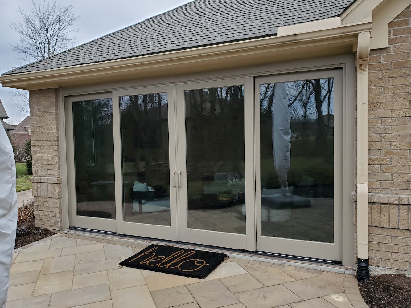 After photo of four-panel sliding glass doors