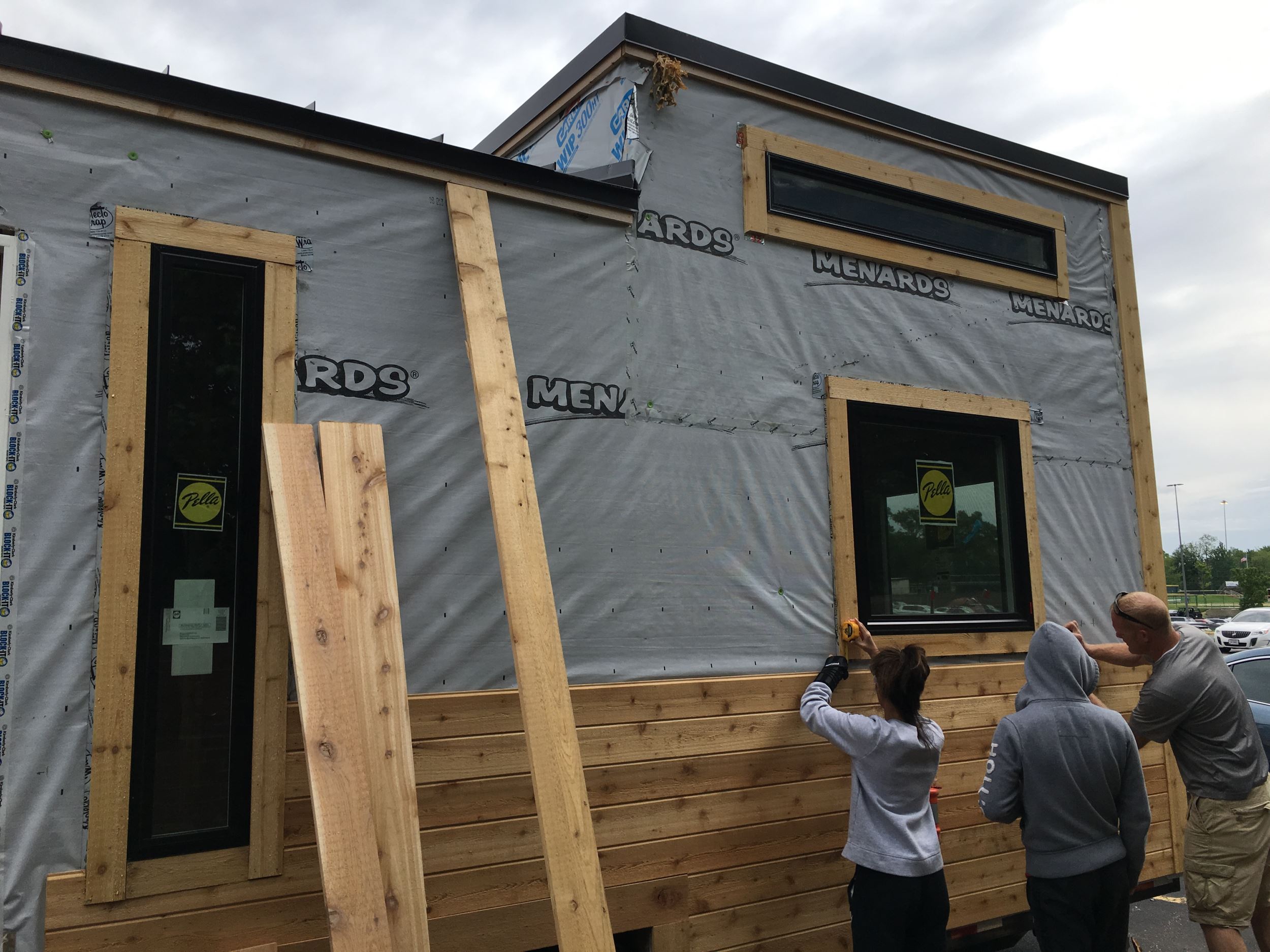 High school students building a tiny house as part of a class project