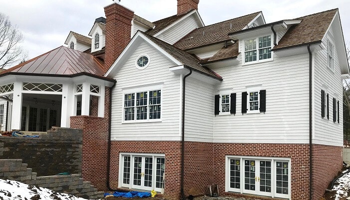 side of bryn mawr home with new wood windos