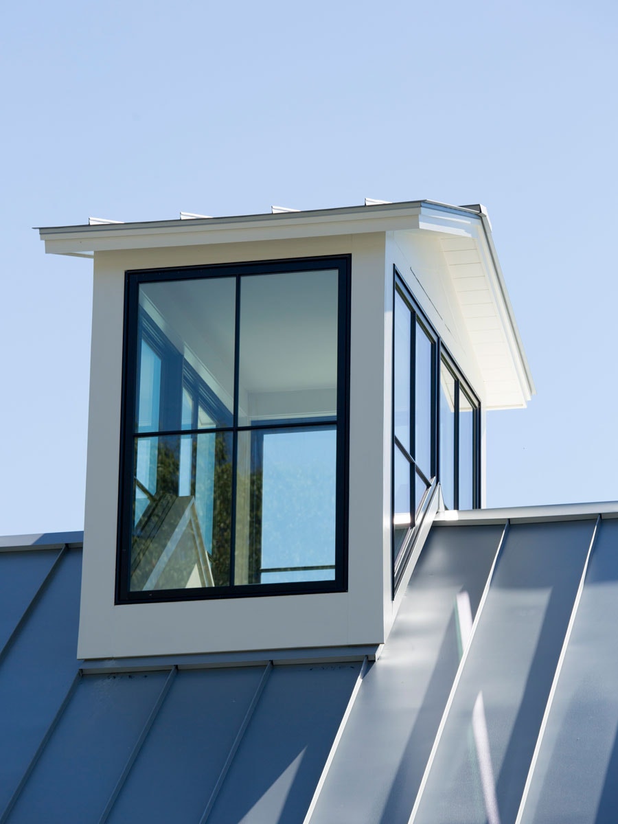 Close-up of large black wood windows on rooftop copulas of home in Williamstown, MA