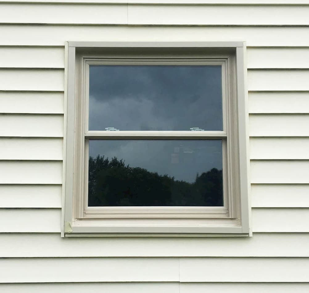Exterior view of new vinyl double-hung window