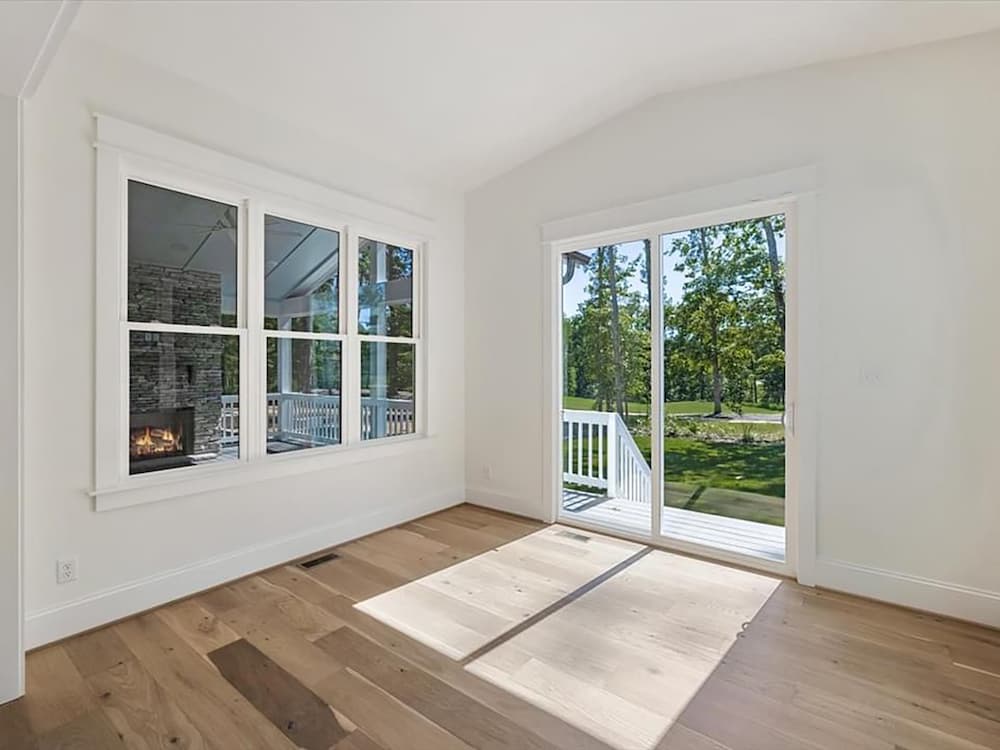Interior of Midlothian home with new white vinyl double-hung windows and sliding patio doors