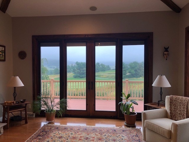 four-panel sliding glass patio door overlooking hilly countryside 