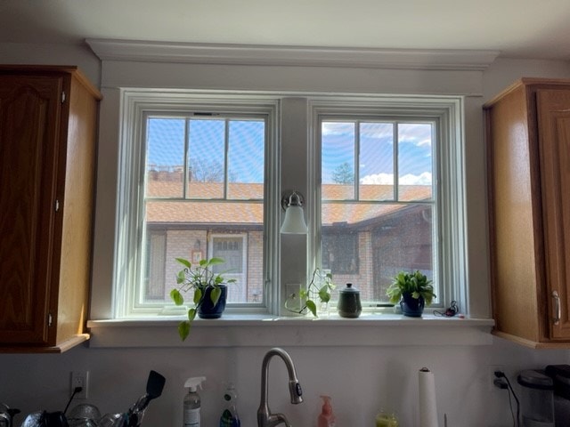 Over-the-sink new white windows in kitchen, from the inside looking out