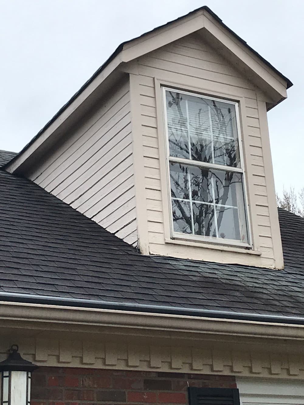 After exterior view of Pella replacement attic window