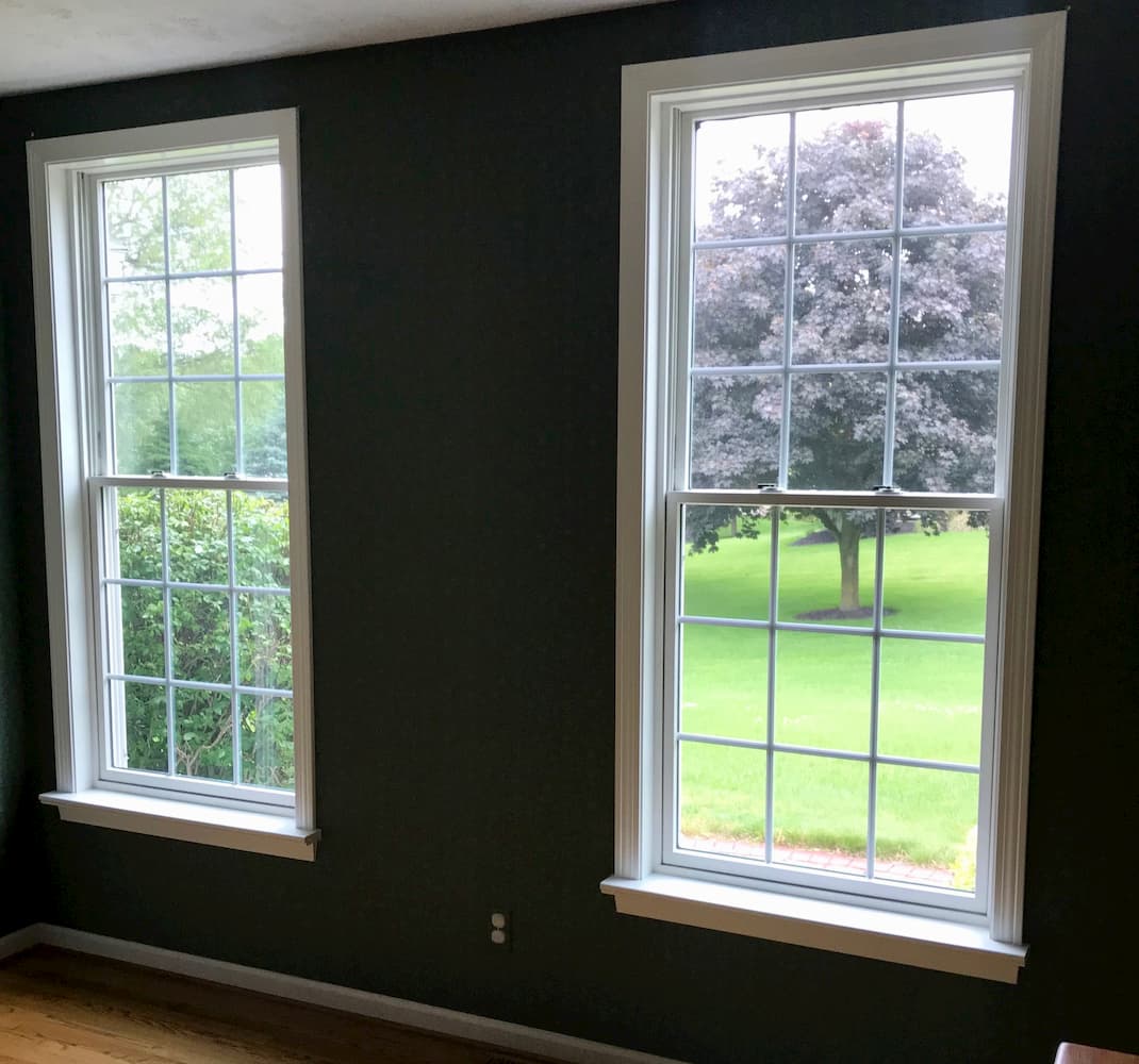 Interior view of two new wood double-hung windows in dining room