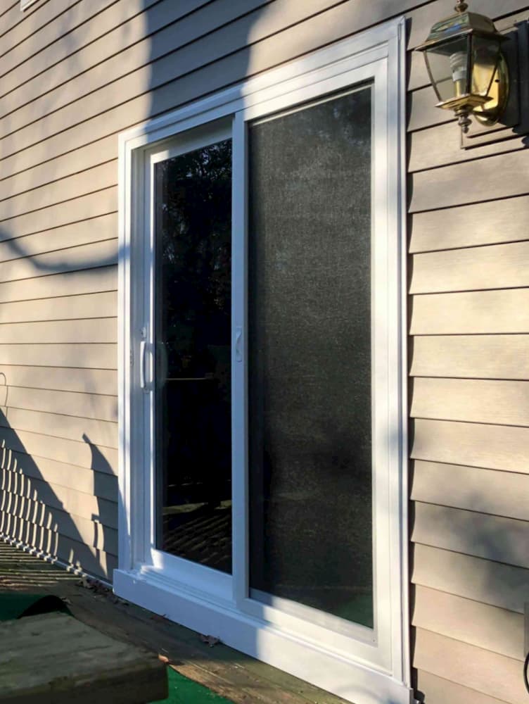 Exterior view of white vinyl sliding patio door