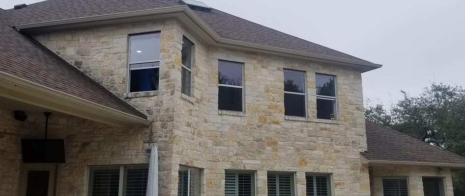 back of austin home with new fiberglass casement, single hung and sliding windows