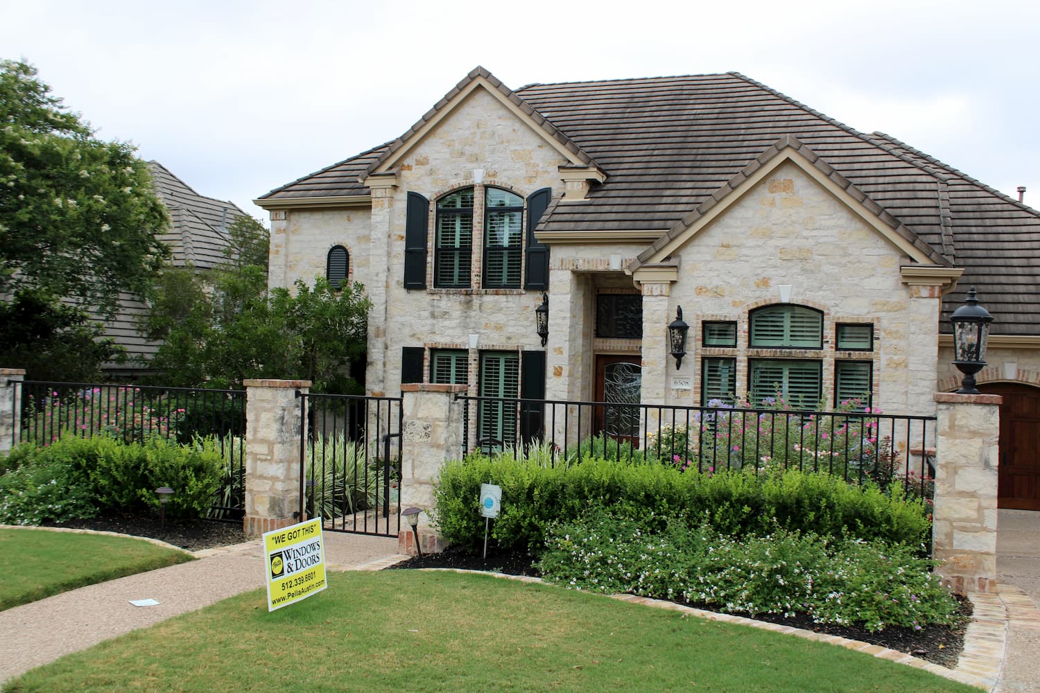 Exterior shot of Austin area home with Pella sign in front yard