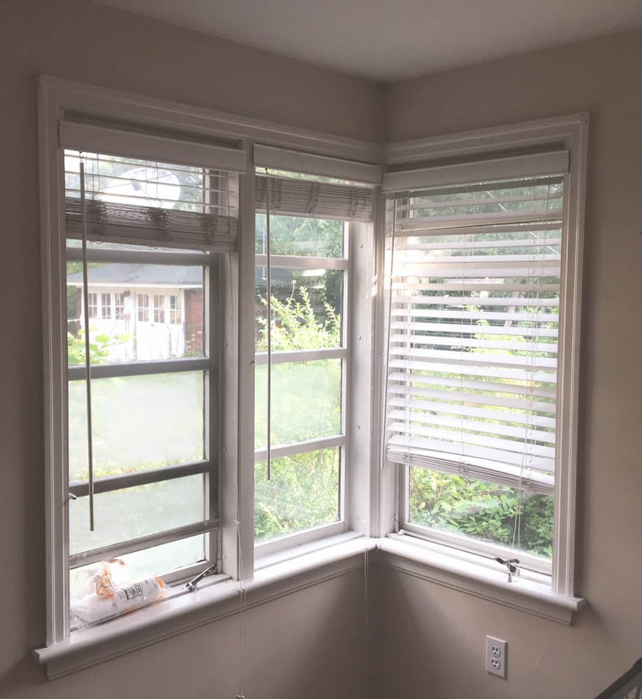 Interior view of old double-hung windows in a corner