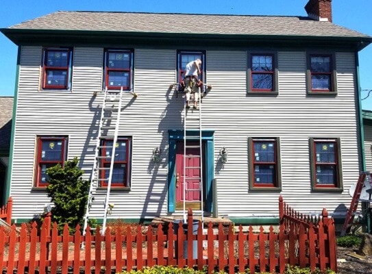 traditional house wood window replacement with vibrant colors