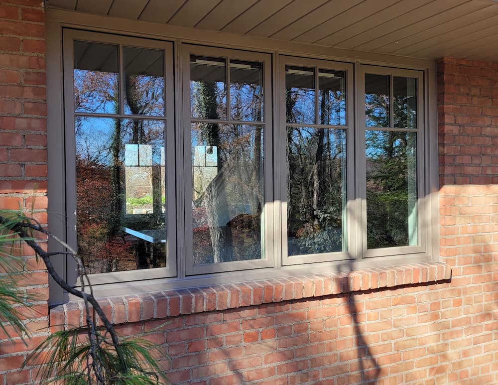 Interior view of four side-by-side replacement casement windows in brownon brick home in Dayton