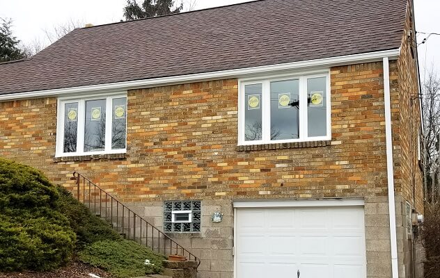 back image of south hills home with new wood casement windows