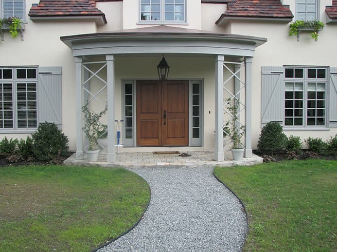 Front exterior view of new wood double entry doors