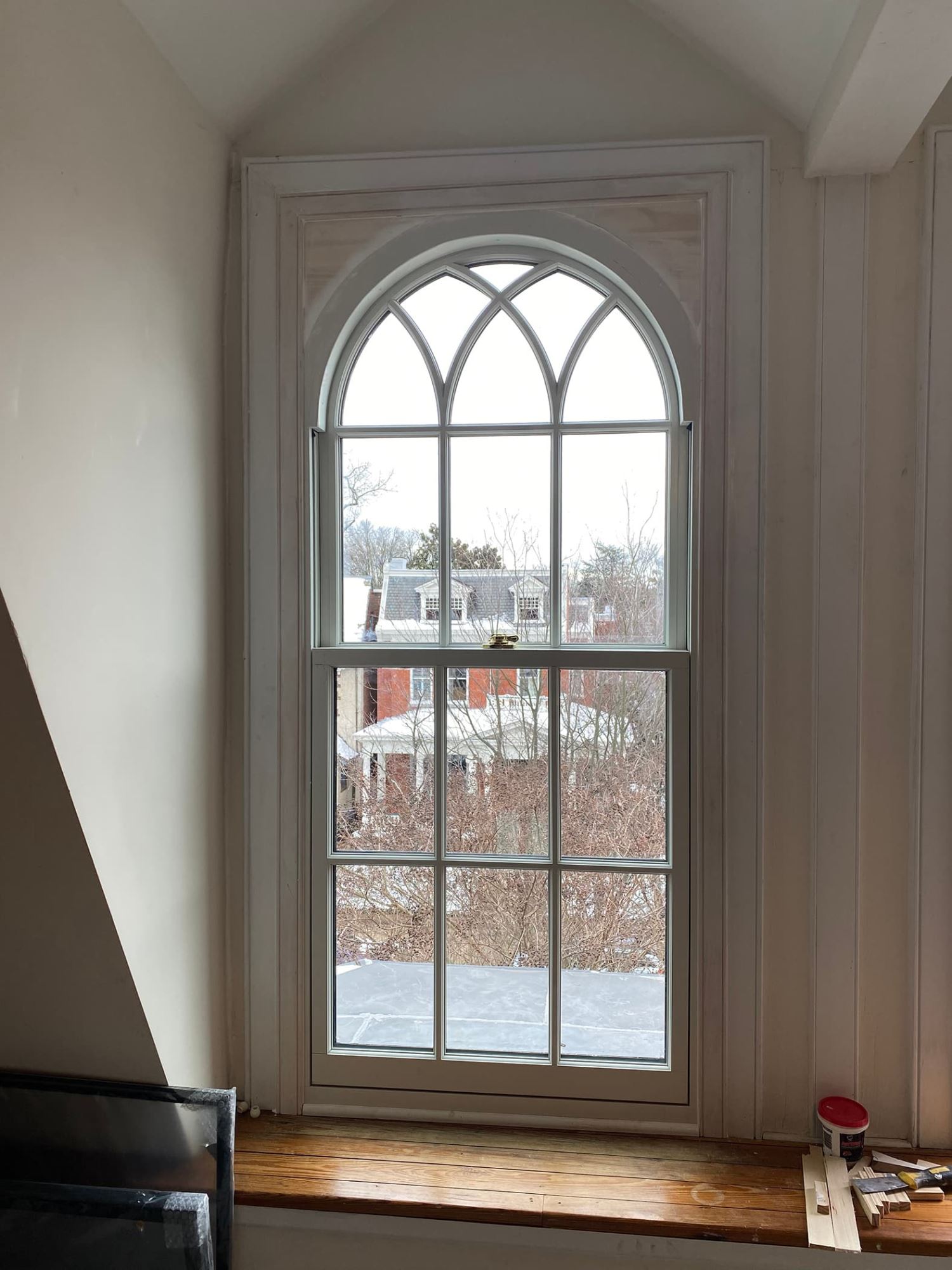 Interior of arched window replacement with custom framing