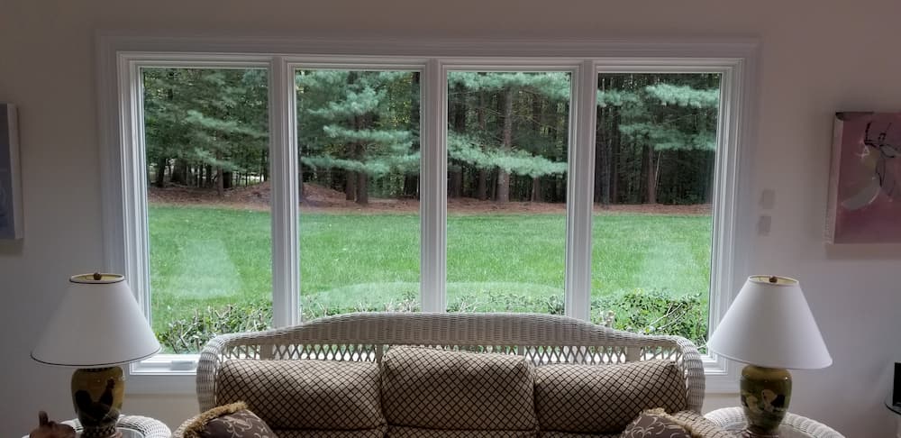 Interior view of four white wood casement windows