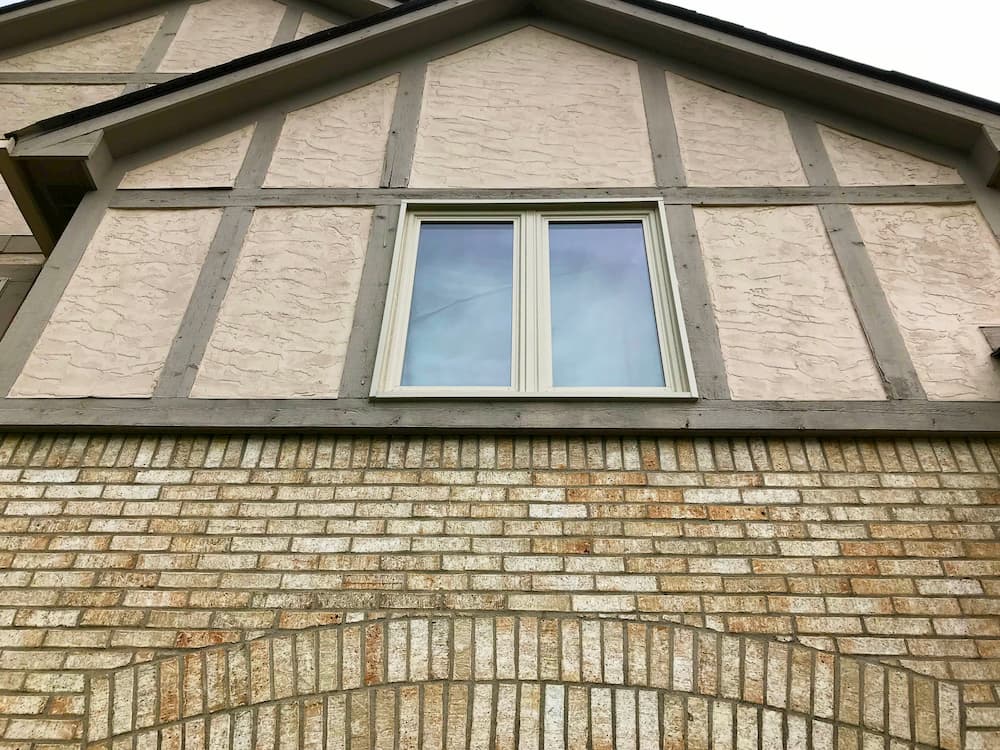 Two new vinyl casement windows in an almond exterior finish