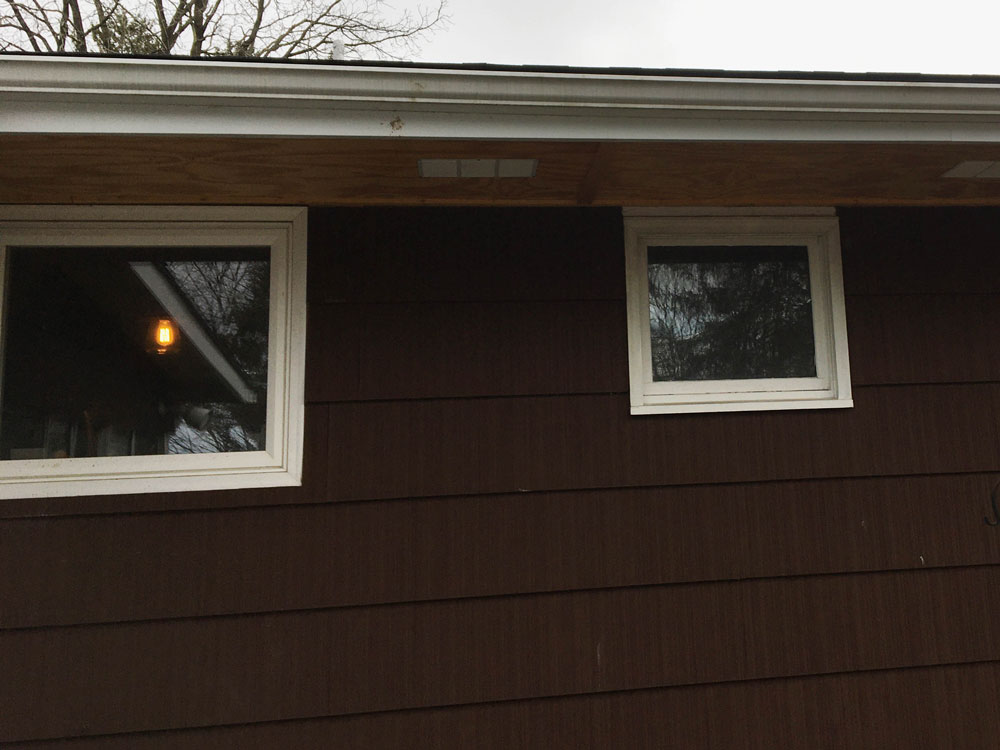 Awning windows on Erie home before upgrade to Pella 250 Series