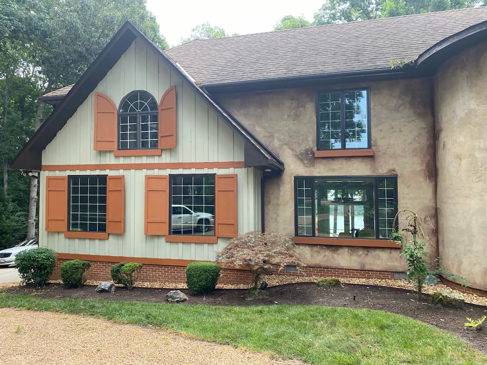 Picture, casement, and special shape windows create unique look on front of Chesterfield home