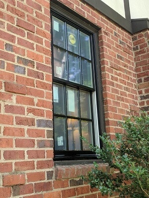 new wood double hung windows get installed in richmond virginia home