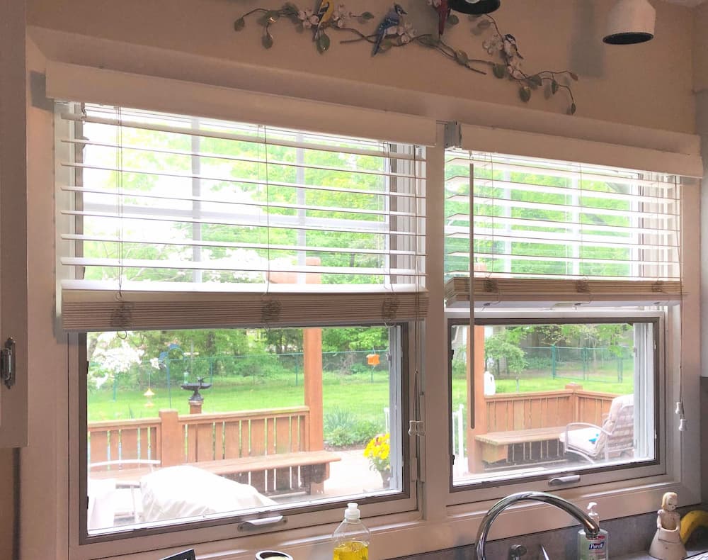Two old single-hung windows over a kitchen sink