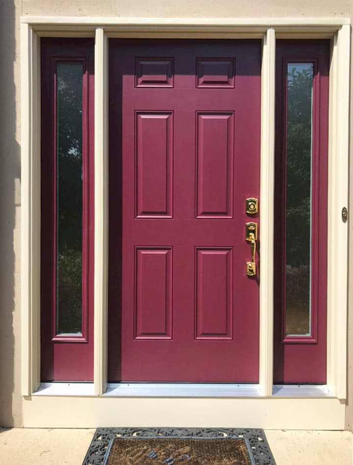 New fiberglass entry door with full-length sidelights in a cranberry color