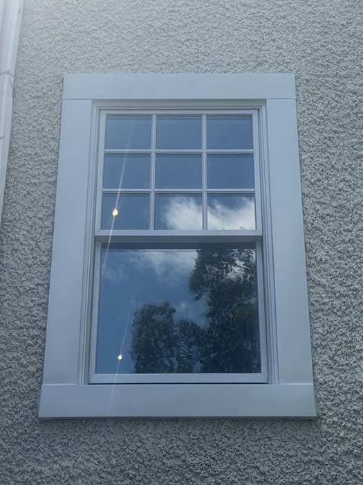 Close-up of white double-hung window on Richmond home