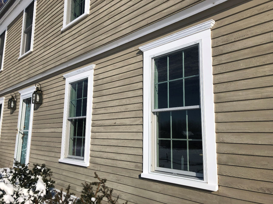 Exterior close-up of double-hung windows in Center Hall Colonial home in Charlotte, VT