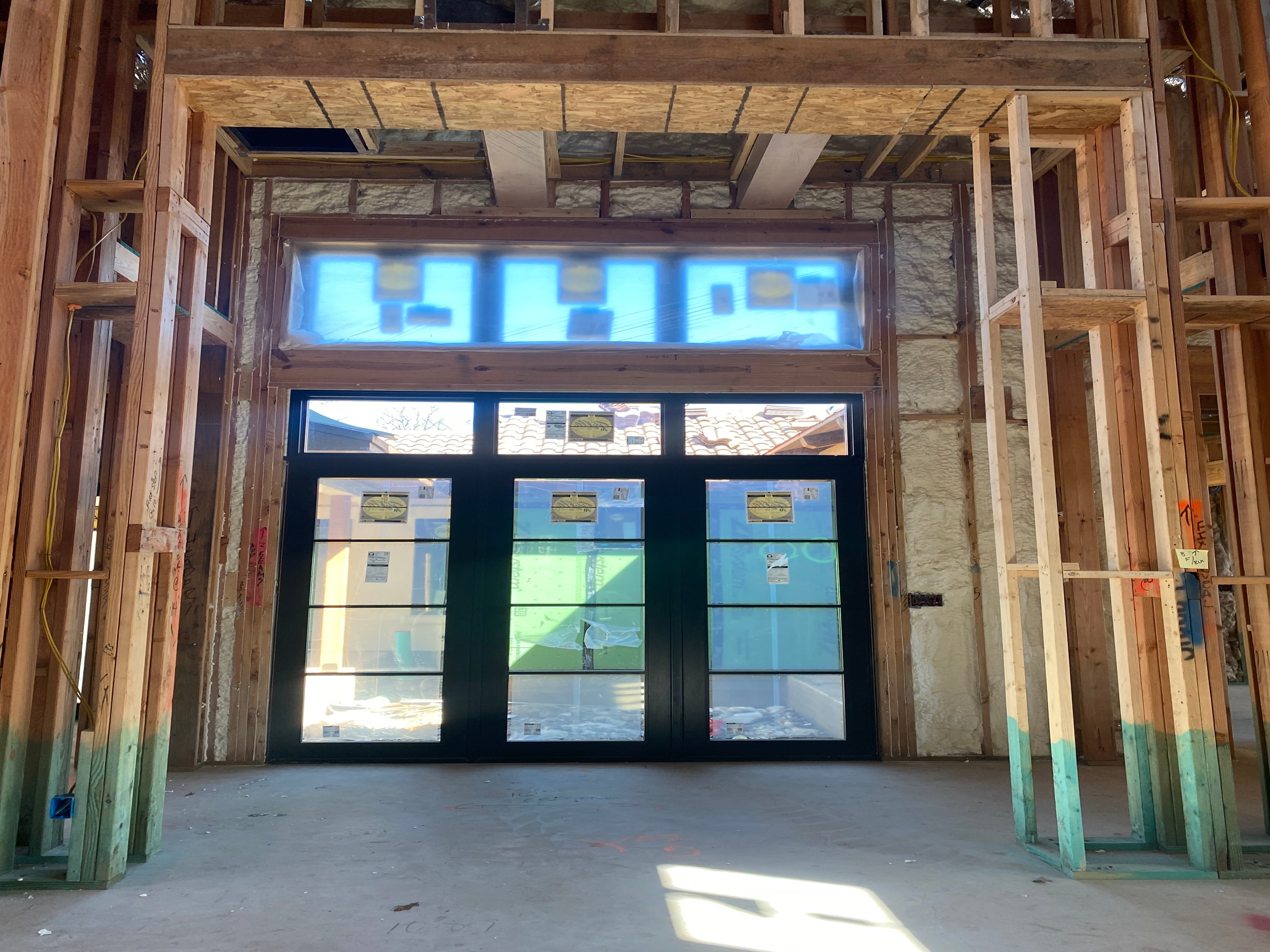 Hinged patio doors and awning windows on new construction in Austin
