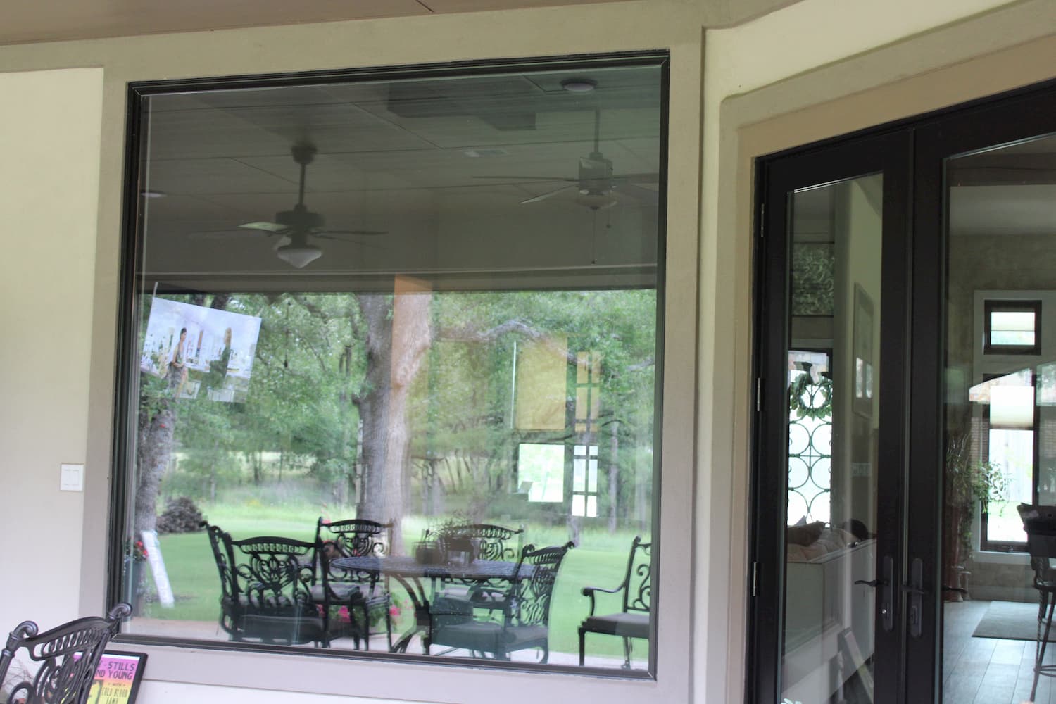 Large rear picture window and double patio doors with glass panels
