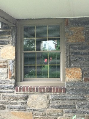 drafty window gets new life with double hung windows front of home