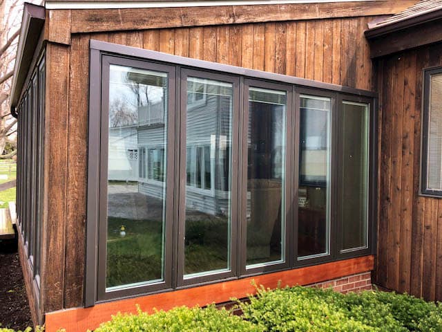 New Pella wood casement windows with brown exterior finish