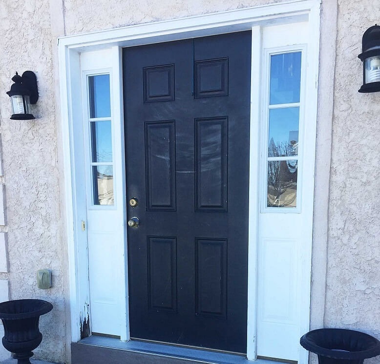Home exterior with black front door