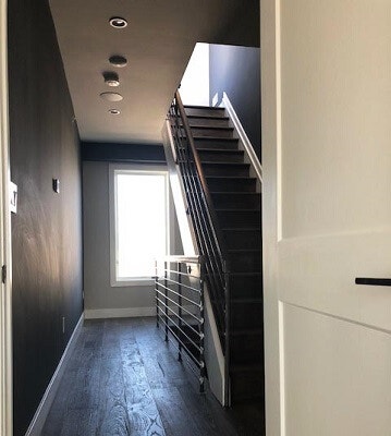 inside view of stairway in Queen Village home with new wood casement windows