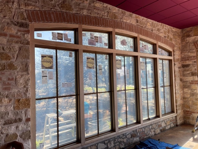 New wood custom shape windows enhance interior and exterior of Trattoria Lisina restaurant