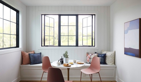 Black-framed Lifestyle Series windows open up a dining nook