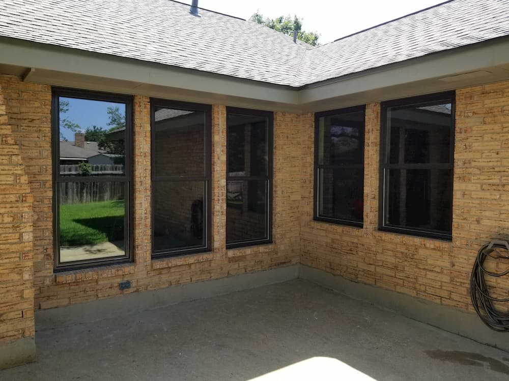 Brick ranch house with new fiberglass and vinyl double-hung windows