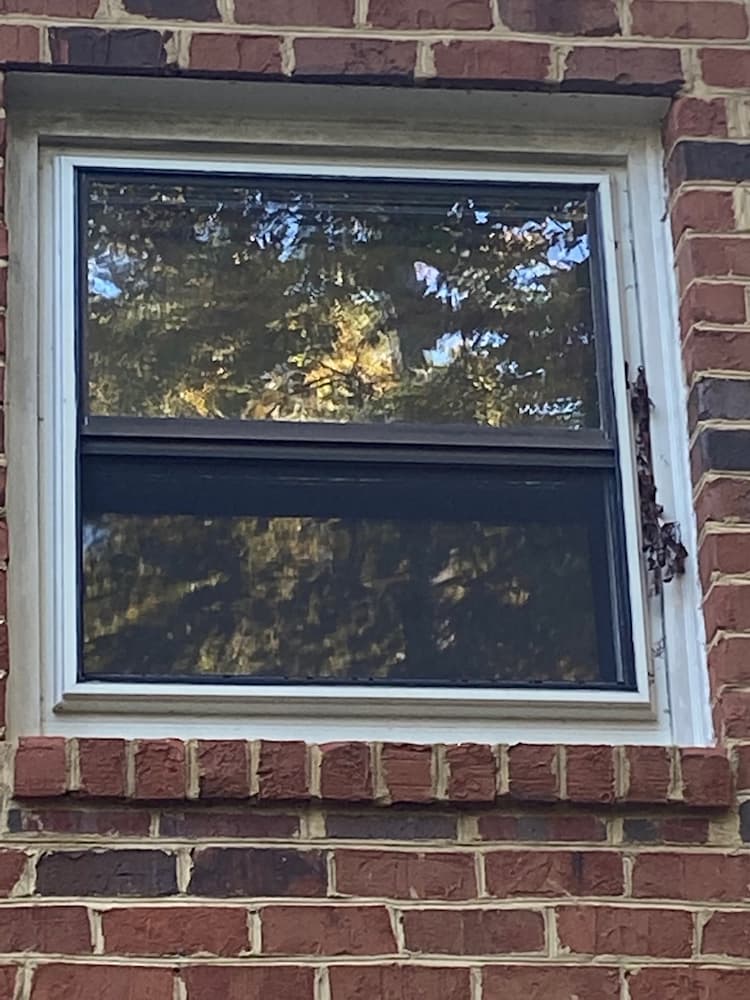 Old windows on Henrico home before replacement