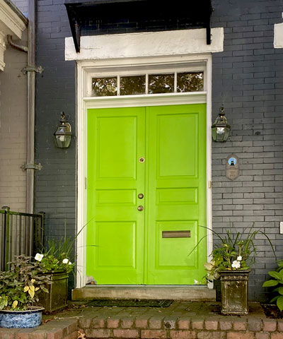 Bright green entry door before replacement