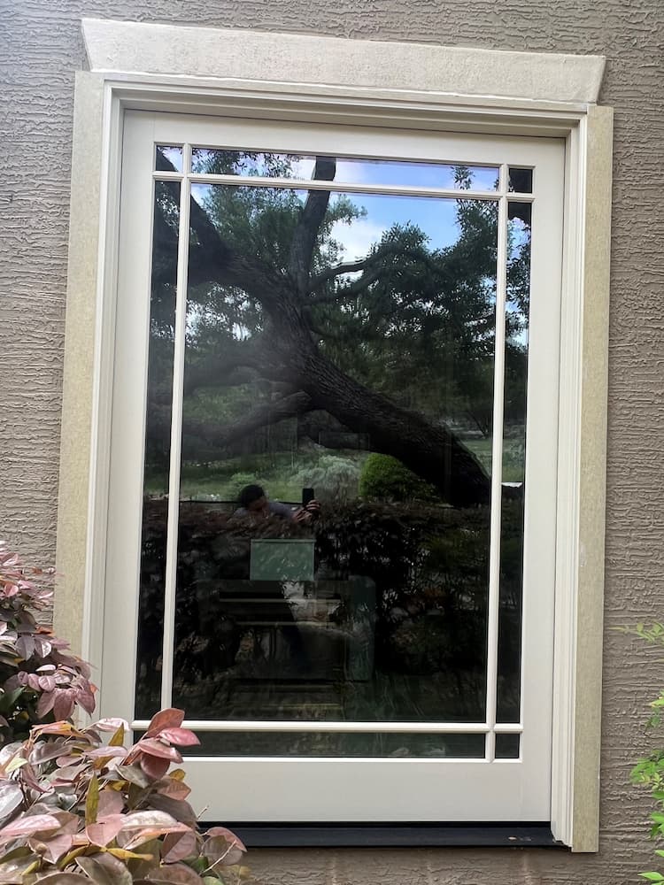 New white patio door with prairie grilles.