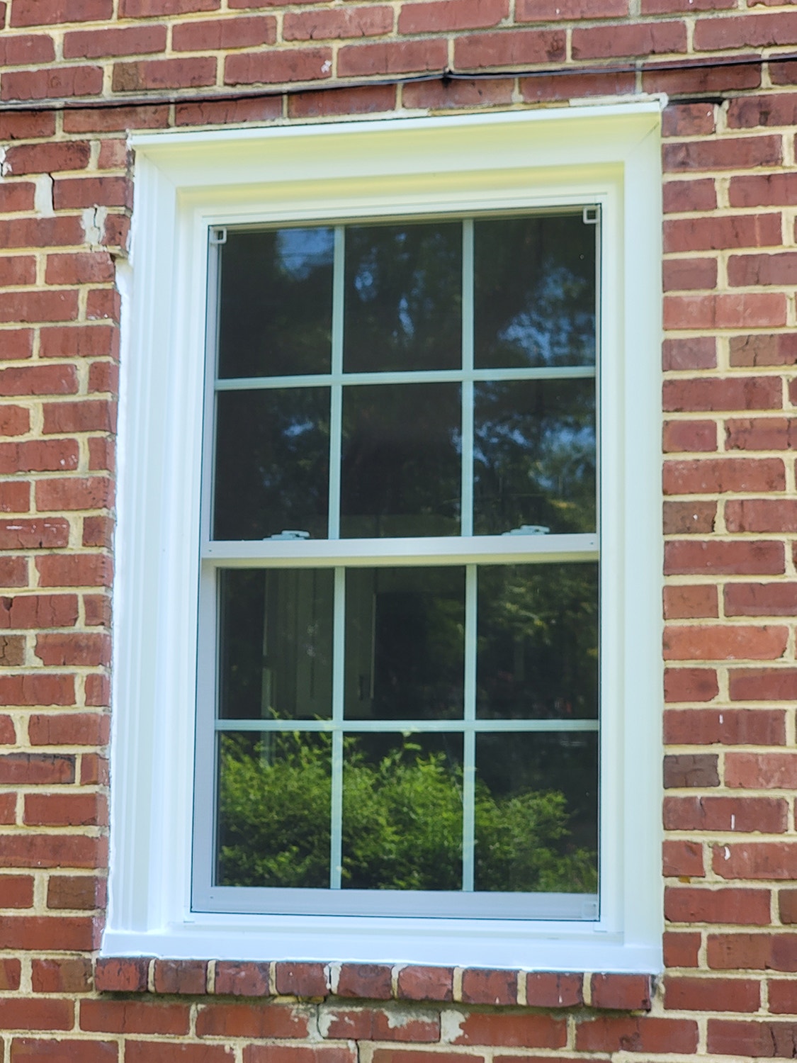 White vinyl double-hung window on Richmond home