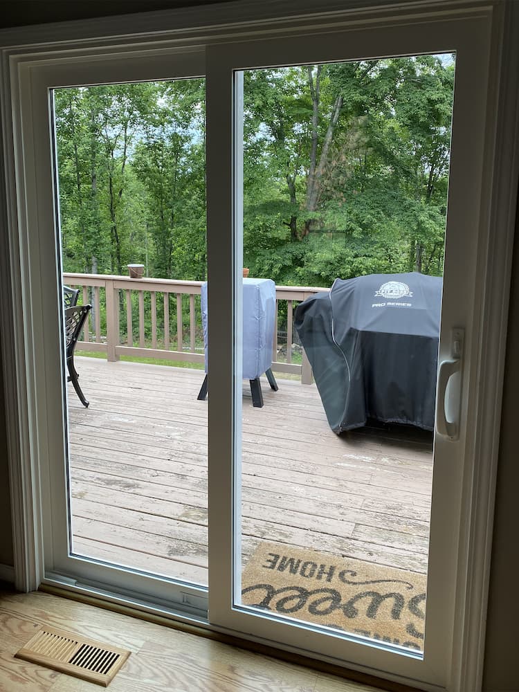 New sliding patio door overlooks deck in Charlottesville
