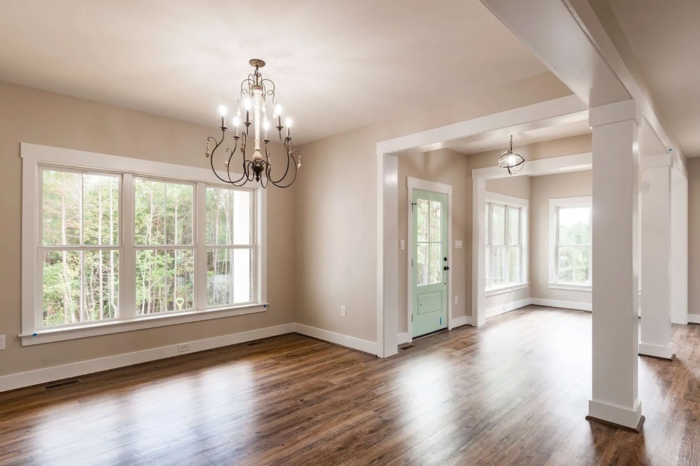 Interior of newly constructed Richmond home with fiberglass casement windows and wood floors
