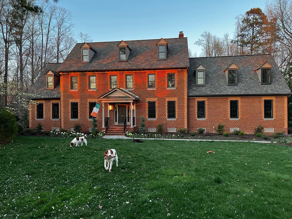 Red brick exterior of Midlothian, VA, home with new wood double-hung windows installed