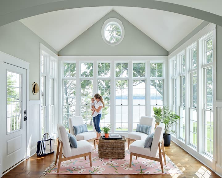 Pella Lifestyle double-hung and special shape windows with traditional grilles in a sunroom