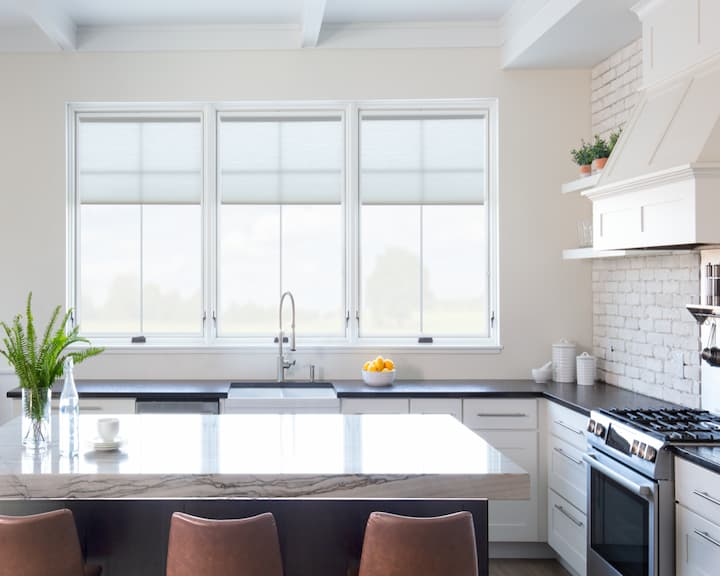 Pella wood windows in a kitchen with shades