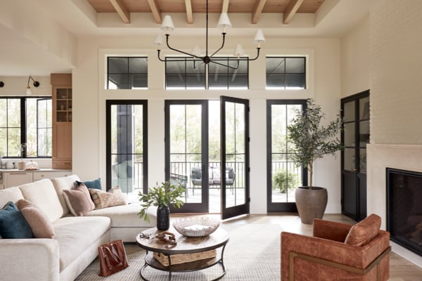 double french doors as a patio door replacement provides elegant touch to a cozy modern living space